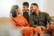© peopleimages.com - Hug, smile and relax with family on sofa in lounge for love, comfortable and happiness together. Care, bonding and break with parents and child in living room at home for silly, morning and support