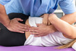 © Microgen - Chiropractor performing a spinal adjustment on a patient lying on a therapy table, focusing on realigning the spine to relieve back pain and improve mobility
