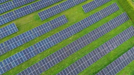 Canvas Print - Renewable solar energy farm in green environment.