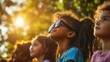 © bird_saranyoo - A diverse group of children watching a solar eclipse, learning about the wonders of astronomy and the science behind celestial events.