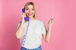 © deagreez - Portrait of impressed girl with bob hair wear t-shirt talk on phone indicating at sale empty space isolated on pink color background