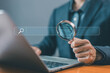 © VRVIRUS - businessman using a laptop show a search bar. concept of keyword search engines, web browser information, SEO optimization, tool digital online. a website to find a job and career on the internet