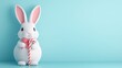 © Boontien - A cute white bunny holding a candy cane against a pastel blue background, perfect for Easter or seasonal decorations.