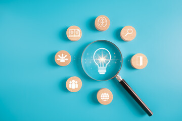 Business goal Success and Creative Solutions.Inspired Work,Brainstorming,Achieving Success and Creative Ideas concept.magnifier focus light bulb and wooden circle with idea icons.