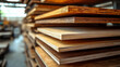 © SashaMagic - A stack of various wooden planks in a workshop.