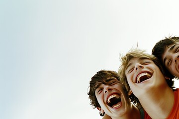 Canvas Print - Three laughing young people enjoying a carefree moment outdoors.