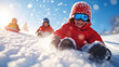 © icehawk33 - joyful child in bright red jacket enjoys sledding down snowy hill, surrounded by friends in winter gear. scene captures excitement of winter fun