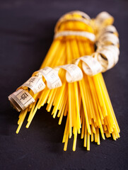 Spaghetti on black background. Close-up spaghetti texture with concepts of long, raw ingredients, Italian food