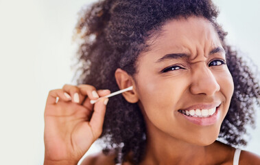 Face, African woman and cotton swab for hygiene on portrait with self care and cleaning. Female person, home and removing earwax for germs, dirt and bacteria for wellness, routine and grooming