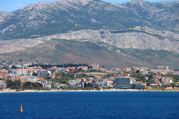 Wall Mural - Contemporary buildings, gardens and beaches at the waterfront in Split, Croatia. View of Split from the boat.