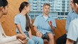 © InfiniteFlow - Attractive boy sharing experience during attend in group therapy. Highschool student talking about way to recovery stress while surrounded with multicultural friend listeing carefully. Edification.