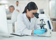 © peopleimages.com - Science, woman and microscope research with medical analysis in clinic laboratory. Chemistry, testing and hospital staff for monkeypox vaccine and scientist work with ppe gear for virus study