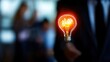 © Inlovehem - Glowing light bulb and businessman