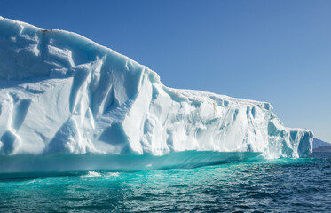 View of glaciers and icebergs in the fjords of South Greenland.