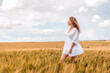 © Константин Плотников - Russia, Republic of Tatarstan, Kalmash village, August 01, 2024, 17:00, girl in a dress in a wheat field in summer