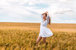 © Константин Плотников - Russia, Republic of Tatarstan, Kalmash village, August 01, 2024, 17:00, girl in a dress in a wheat field in summer