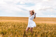 © Константин Плотников - Russia, Republic of Tatarstan, Kalmash village, August 01, 2024, 17:00, girl in a dress in a wheat field in summer