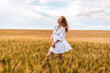 © Константин Плотников - Russia, Republic of Tatarstan, Kalmash village, August 01, 2024, 17:00, girl in a dress in a wheat field in summer