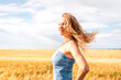 © Константин Плотников - Russia, Republic of Tatarstan, Kalmash village, August 01, 2024, 17:00, girl in a dress in a wheat field in summer