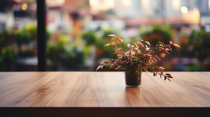 Wall Mural - A small plant sits on a wooden table in front of a window with a city view.