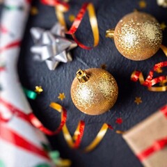 A studio shot of New Year's Eve decorations from above, using extreme macro and tilt-shift. The photo showcases close-up details of festive elements like tiny streamers and party hats, with a