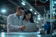 © useful pictures - Team of researchers analyzing data in a high-tech laboratory setting during the late afternoon in a modern industrial facility