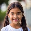 © LIGHTFIELD STUDIOS - high-resolution extreme close-up shot of a girl child joyful expression, with rack focus highlighting the fine details of the face and softly blurring the surroundings.