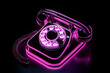 © Neon Gallery - Sleek neon silhouette of a vintage rotary phone glowing against a black backdrop.