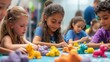 © Sergey - A joyful scene of children sculpting small animals and shapes from soft clay during a workshop