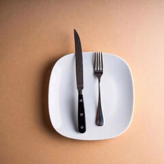 knife on the table with a white plate and a knife.