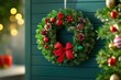 © Natchanok - Decorative Red and Green Holiday Wreath on Wall
