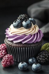 Wall Mural - Delicious cupcake topped with cream and berries on a dark surface, perfect for dessert lovers