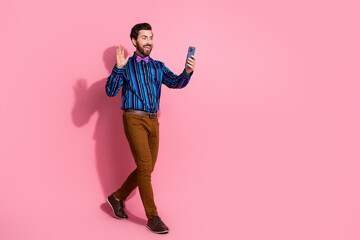 Photo of cheerful funny excited elegant man wear stylish clothes walk isolated on pink color background