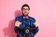 © deagreez - Photo of crazy worried funny man wear stylish clothes drive car vehicle isolated on pink color background