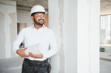 Asian Engineer standing on site construction posting confident , Engineer construction happy job success