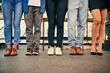 © peopleimages.com - Fashion, legs and shoes with friends in line outdoor, together for holiday, travel or vacation. City, concrete and feet with group of people in row for solidarity or unity at overseas location