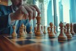 © Joaquin Corbalan - A close-up view of a player moving a wooden chess piece on a well-lit chessboard in an urban setting during an afternoon game