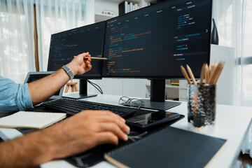 Cropped hands pointing of IT developer's data software development on pc, creating application program version online website page system showing to target customer, working at modern office. Surmise.