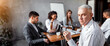 © Prostock-studio - Business People. Serious Mature Entrepreneur Sitting At Corporate Meeting Looking At Camera In Office. Free Space