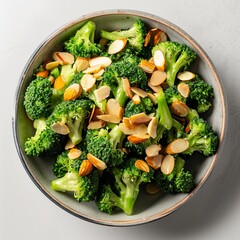 A bowl of steamed broccoli with almonds, perfect for a healthy and delicious side dish
