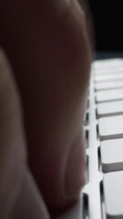 Wall Mural - close-up man typing on computer keyboard with hands and fingers. macro soft focus dolly shot. comput
