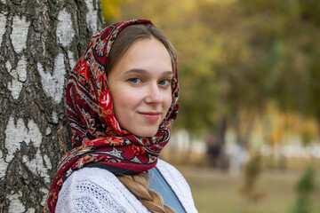 Wall Mural - Russian beauty - young beautiful woman in a traditional headscarf