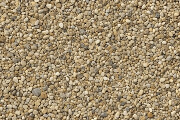 Seamless gravel texture material in beige and grey tones created by nature