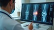 © vitanovski - Doctor Conducting Ultrasound Examination of Knee Joint X-ray Display