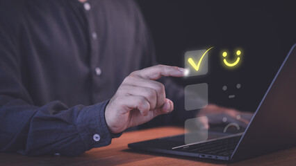 Fototapete - Customer select a happy face icon on a feedback scale with neutral and sad face options below. Concept symbolized customer satisfaction, online reviews, decision-making in user experience evaluation.