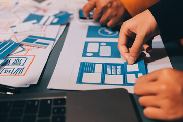The designer team is designing the uxui system to make the uxui system work well on new phones and support system updates. Website development concept UI UX front end designer
