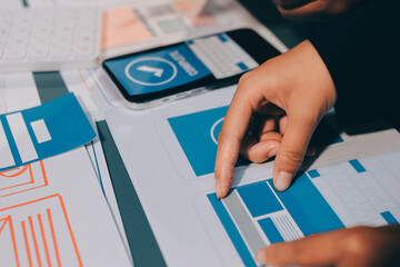 The designer team is designing the uxui system to make the uxui system work well on new phones and support system updates. Website development concept UI UX front end designer