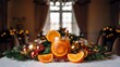 © ahmed - A festive glass of orange cocktail with cinnamon and ice sits amongst a Christmas centerpiece of greenery, red and gold ornaments, on a white tablecloth.
