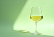 © PTD - glass of white wine on green background creates refreshing atmosphere