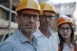 © darshika - Portrait of three architects wearing hardhats